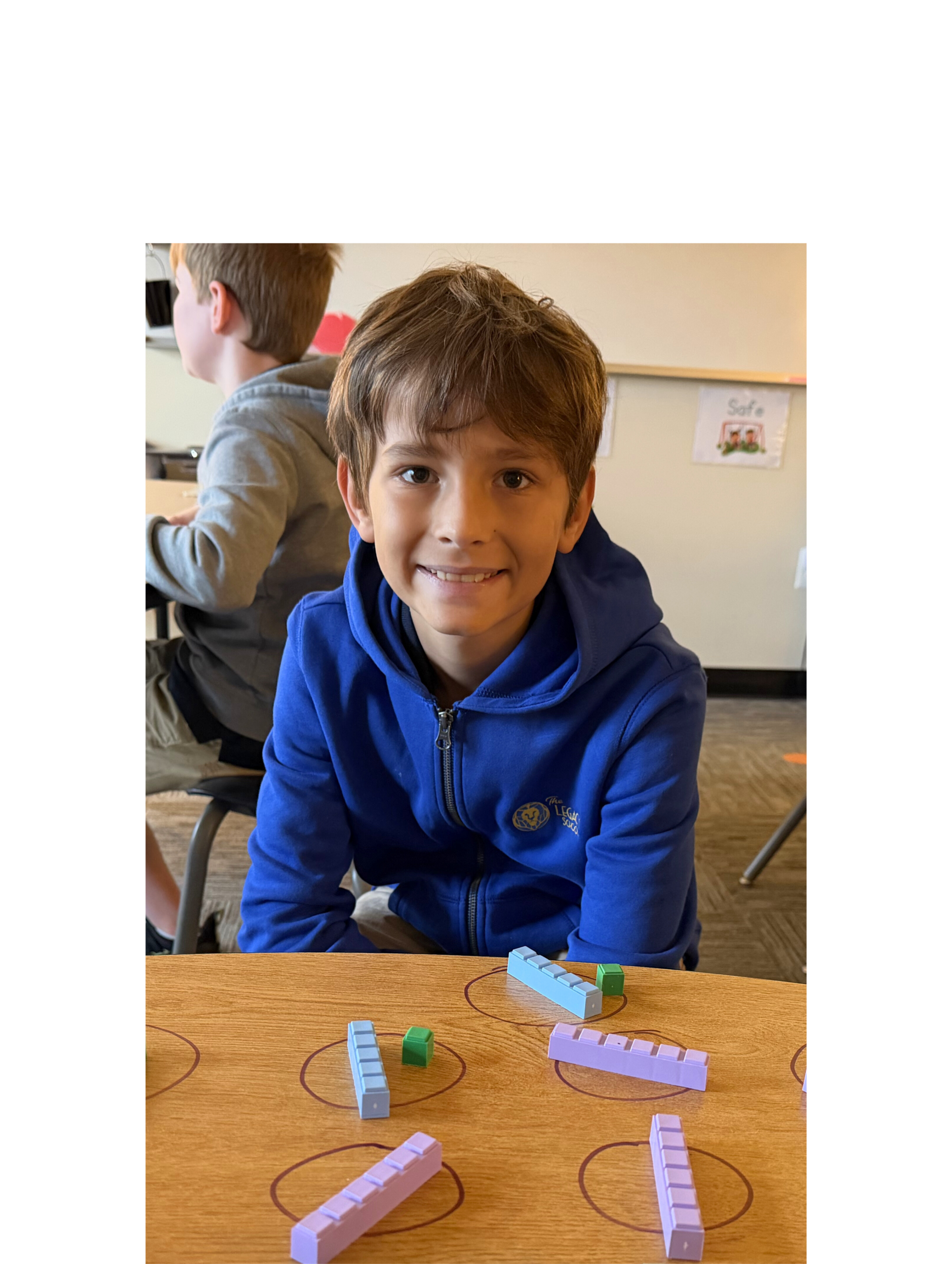 A Lower School student uses manipulatives to solve a math problem as part of The Legacy School's multi-sensory curriculum for students with language-based learning disabilities and differences.