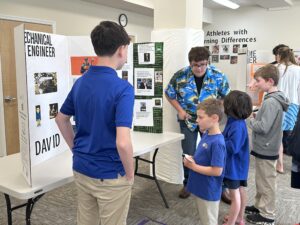 As part of their writing curriculum, The Legacy School’s 8th graders researched careers, created poster boards, presented on their chosen career, practiced public speaking, and fielded questions from students connecting school to real-world career paths.