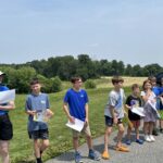The Legacy School students celebrate the graduating 8th Graders with the Clap Out!