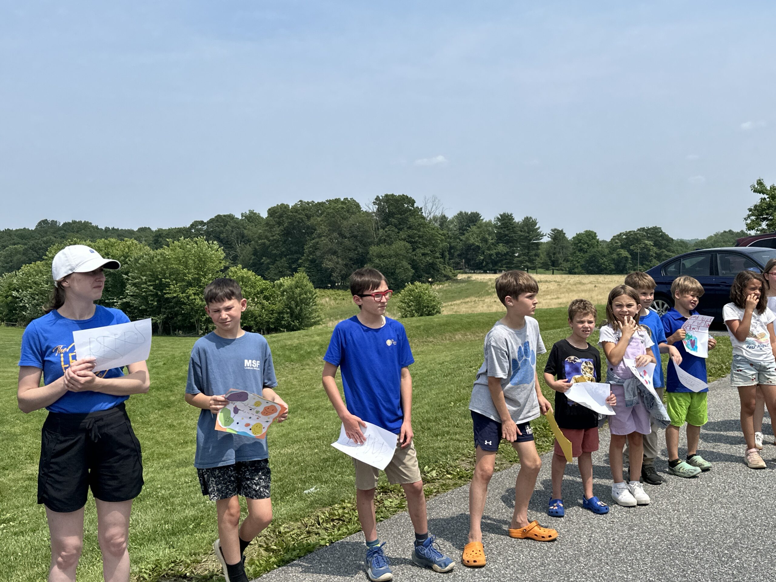 The Legacy School students celebrate the graduating 8th Graders with the Clap Out!