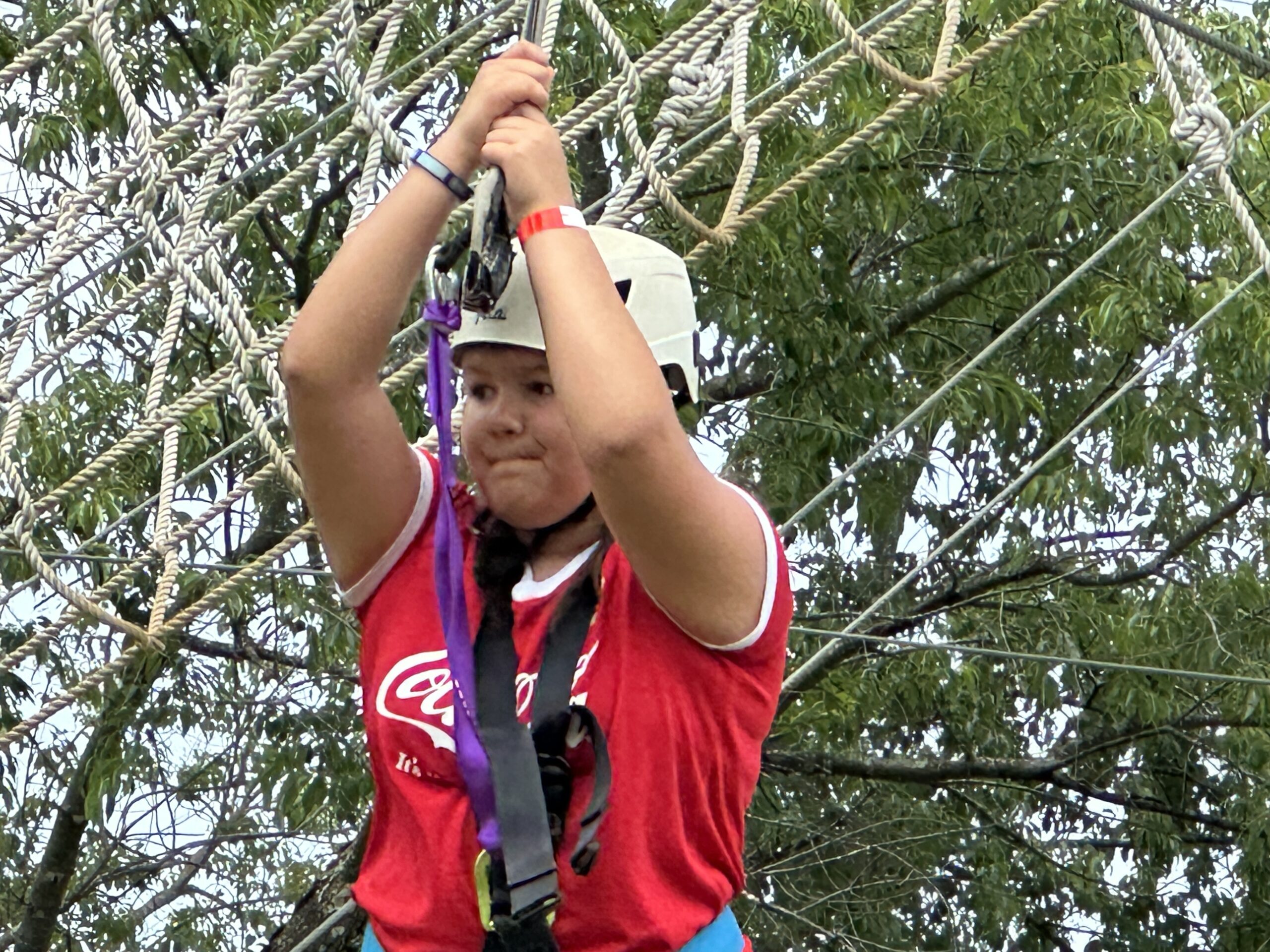 A student at The Legacy School plays on the ropes course at Kids After Hours at Red Barn Ranch
