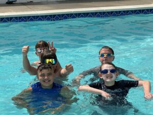 Students at Camp Terrapin at The Legacy School swim in the on-campus pool
