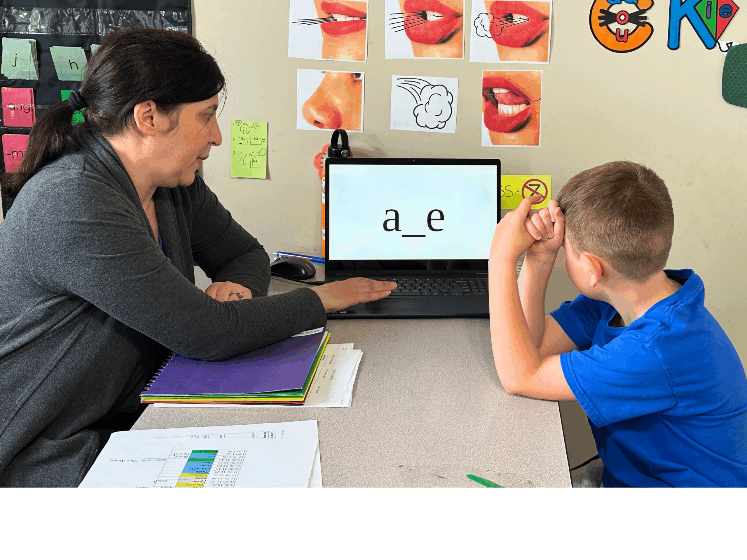 IMG_5352.jpg-EDITED (Ms. Lorie and Primary Student) A tutor at The Legacy School works with a Primary School student.