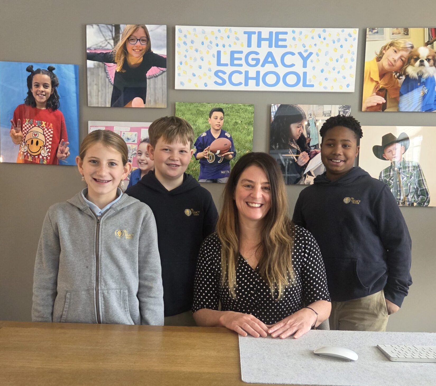 Founder and Head of School Jamie Caplan poses with 3 students at The Legacy School.